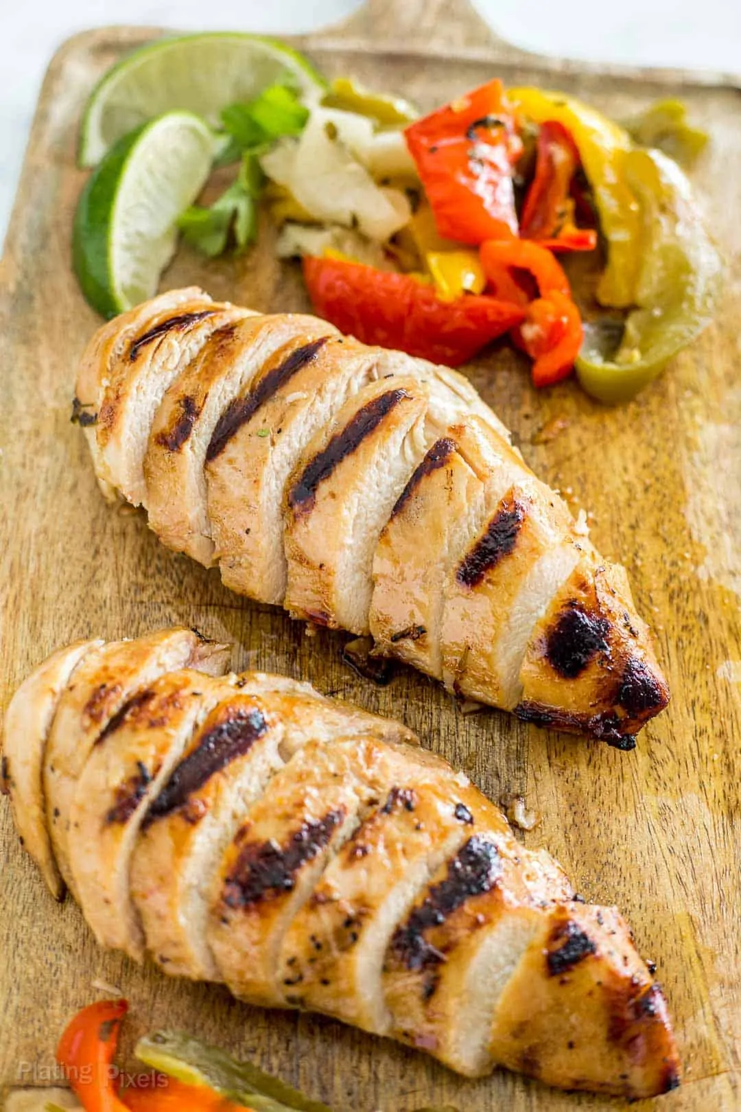 Grilled Chicken Fajitas sliced on a cutting board