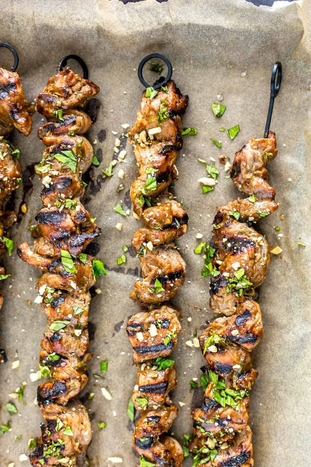 Close up of grilled pork satay on skewers