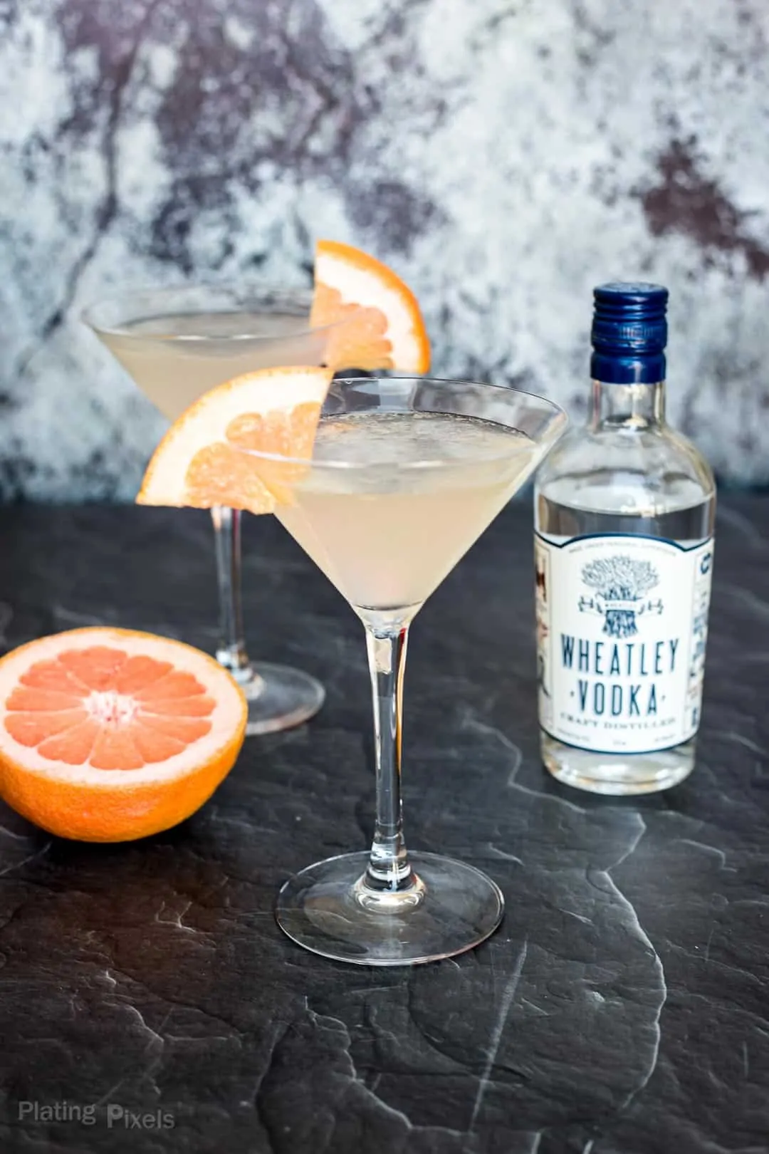 Prepared Grapefruit Martinis next to a bottle of Wheatley Vodka