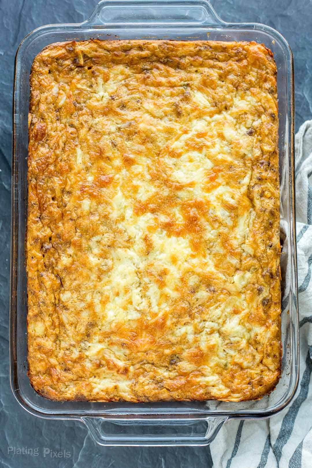 Just baked Hash Brown Breakfast Casserole in a glass baking dish