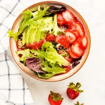 Prepared Summer Strawberry Salad next to fresh stawberries