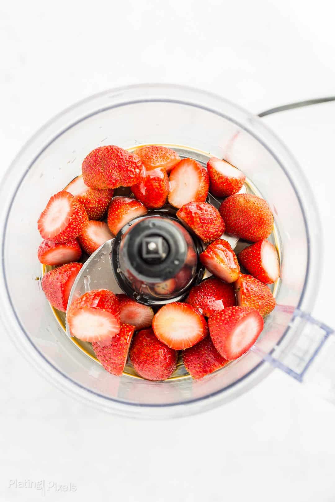 Fresh stawberries in a food processor