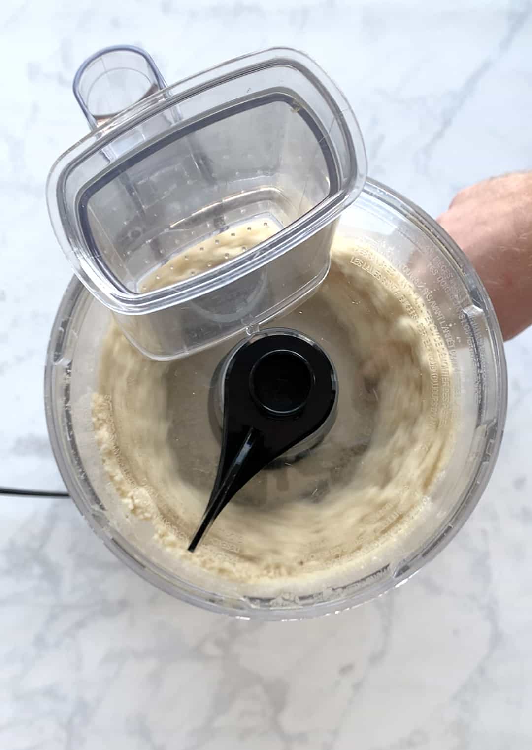 Process shot of dough in a food processor