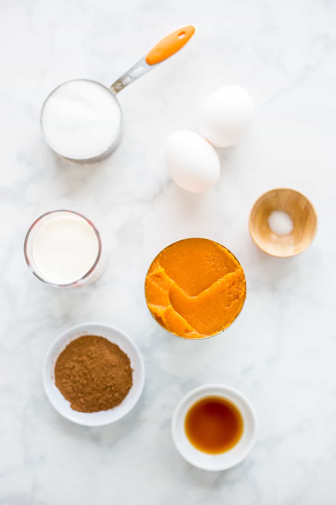 Ingredients for pumpkin pie filling prepared on a counter