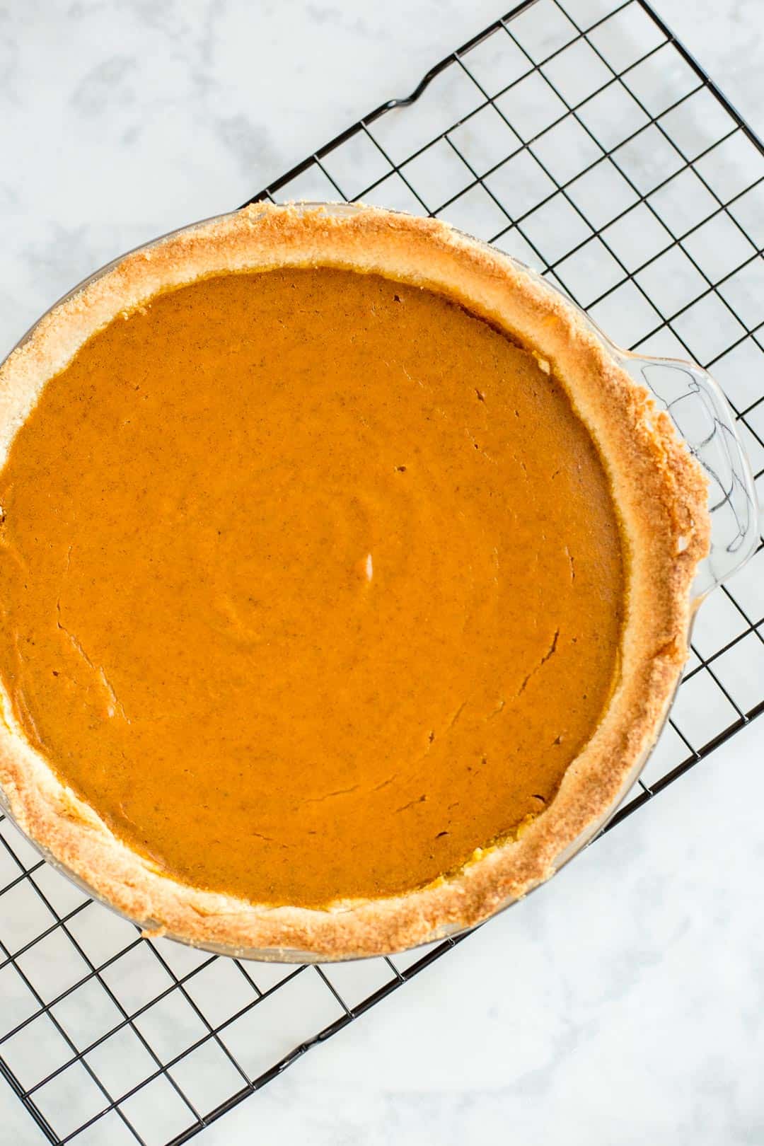 Just baked Keto Pumpkin Pie on a wire rack