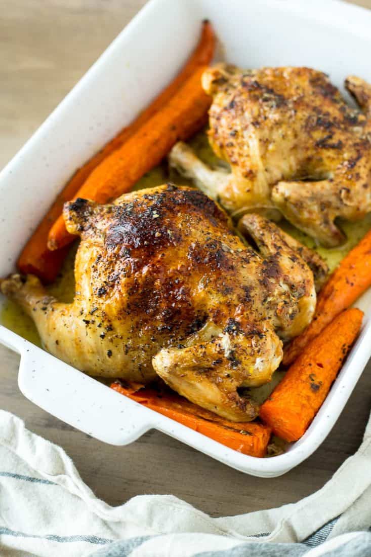 Close up of a Cornish Game Hen in a casserole dish