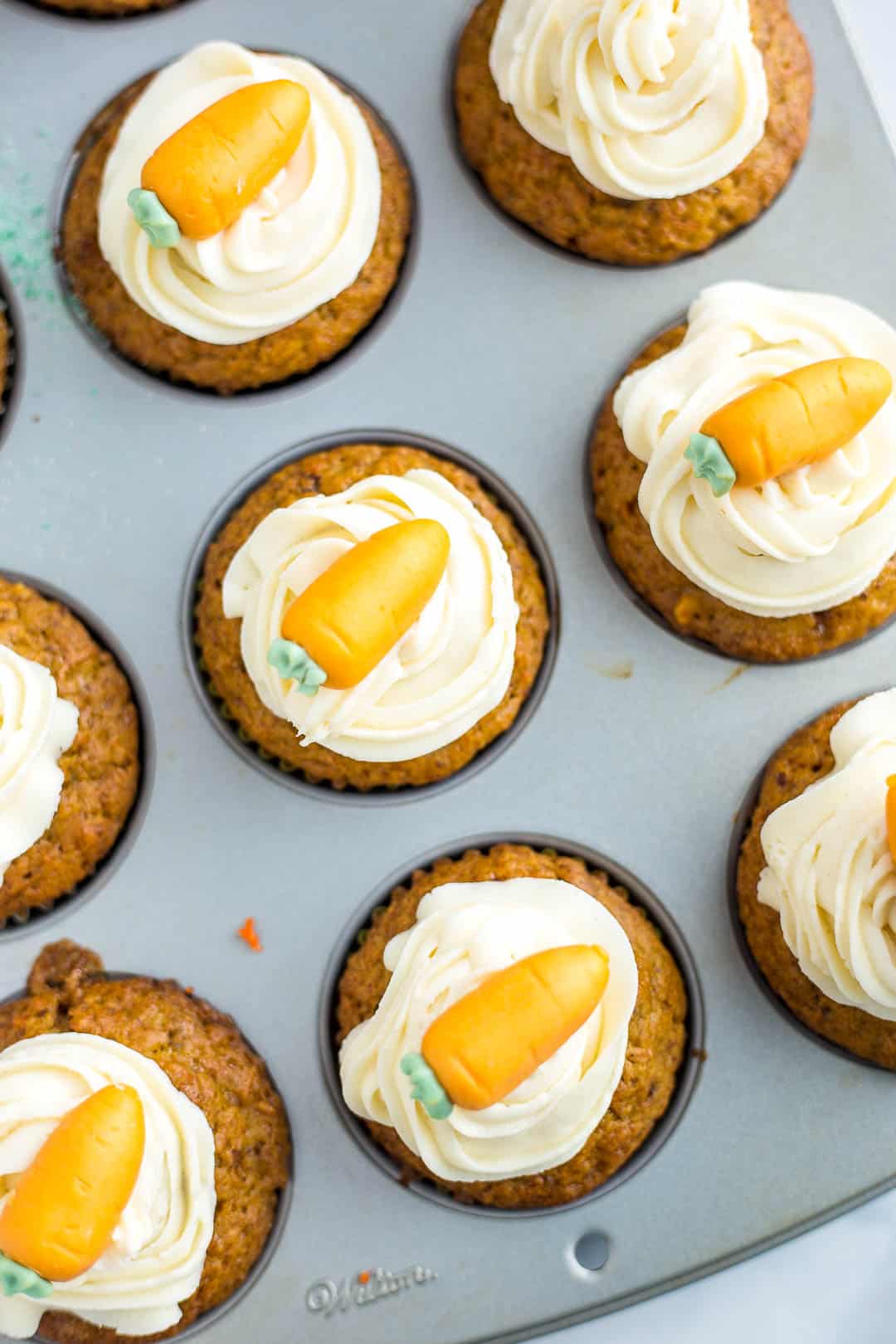 Decorated Carrot Cake Cupcakes in a cupcake pan