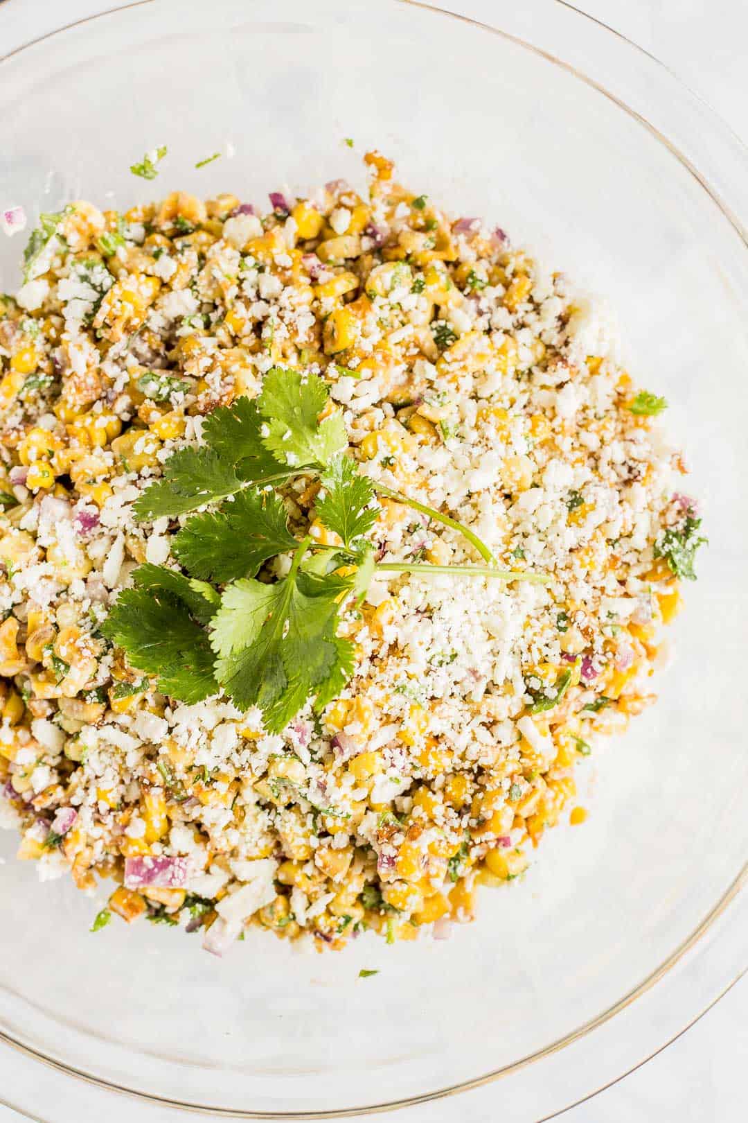 Mexican Corn Salad in a bowl garnished with cilantro