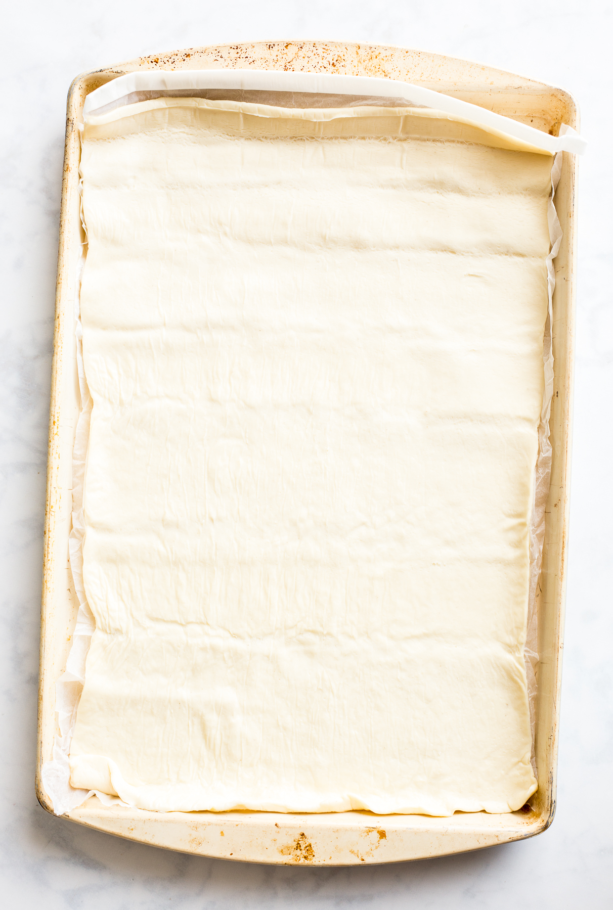 Sheet of Jus-Rol puff pastry sheet on a baking sheet
