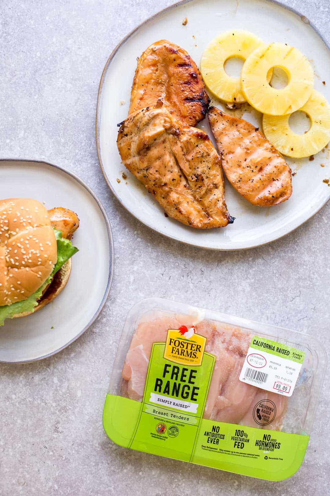 Grilled Teriyaki Chicken Burger next to a package Foster Farms Chicken Breasts