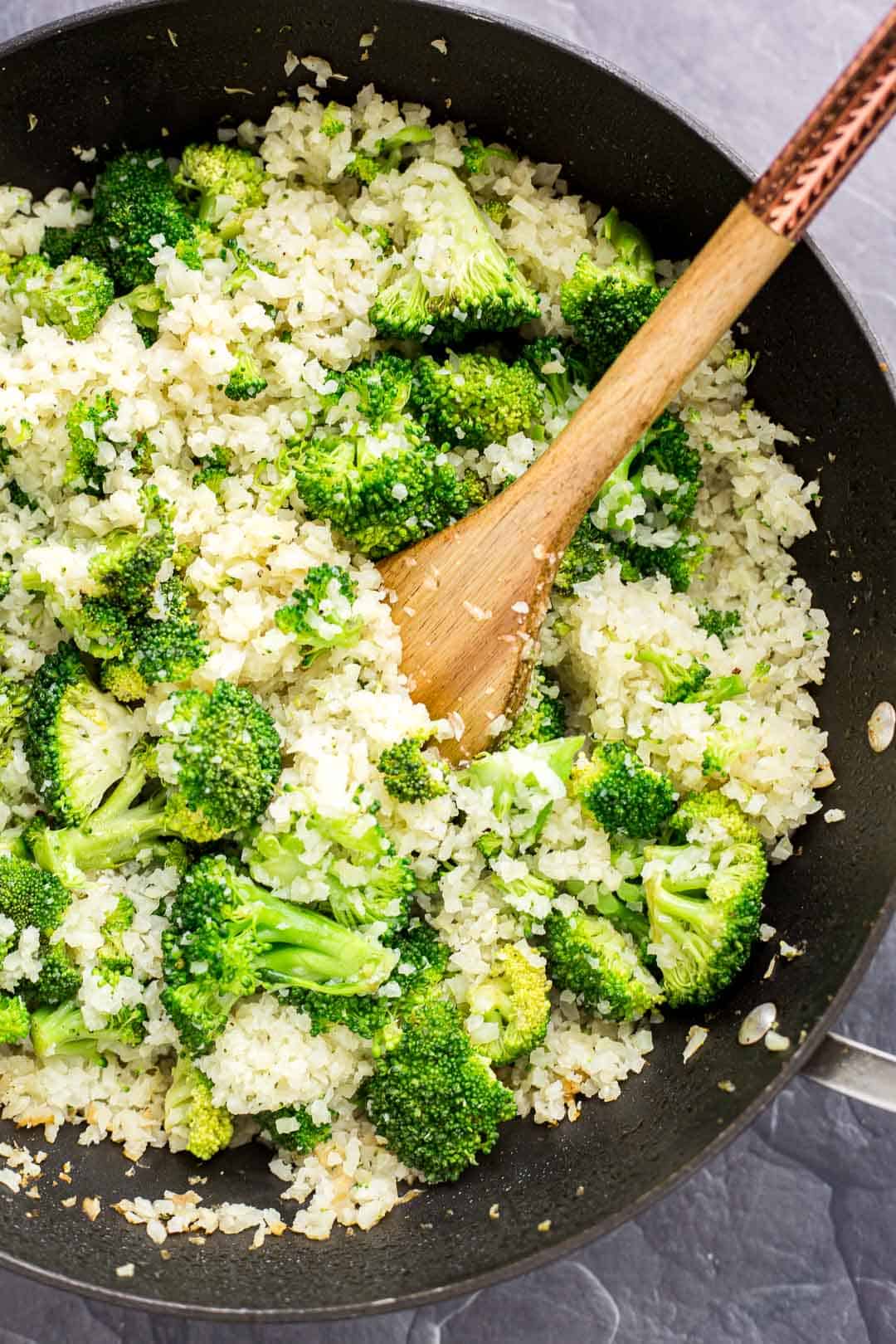 Process shot of cooking cauliflower rice and broccoli