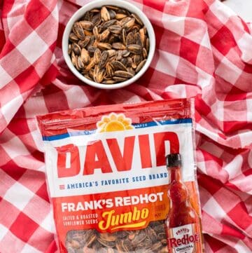 Bag of DAVID Frank’s RedHot Sunflower Seeds on a red and white background