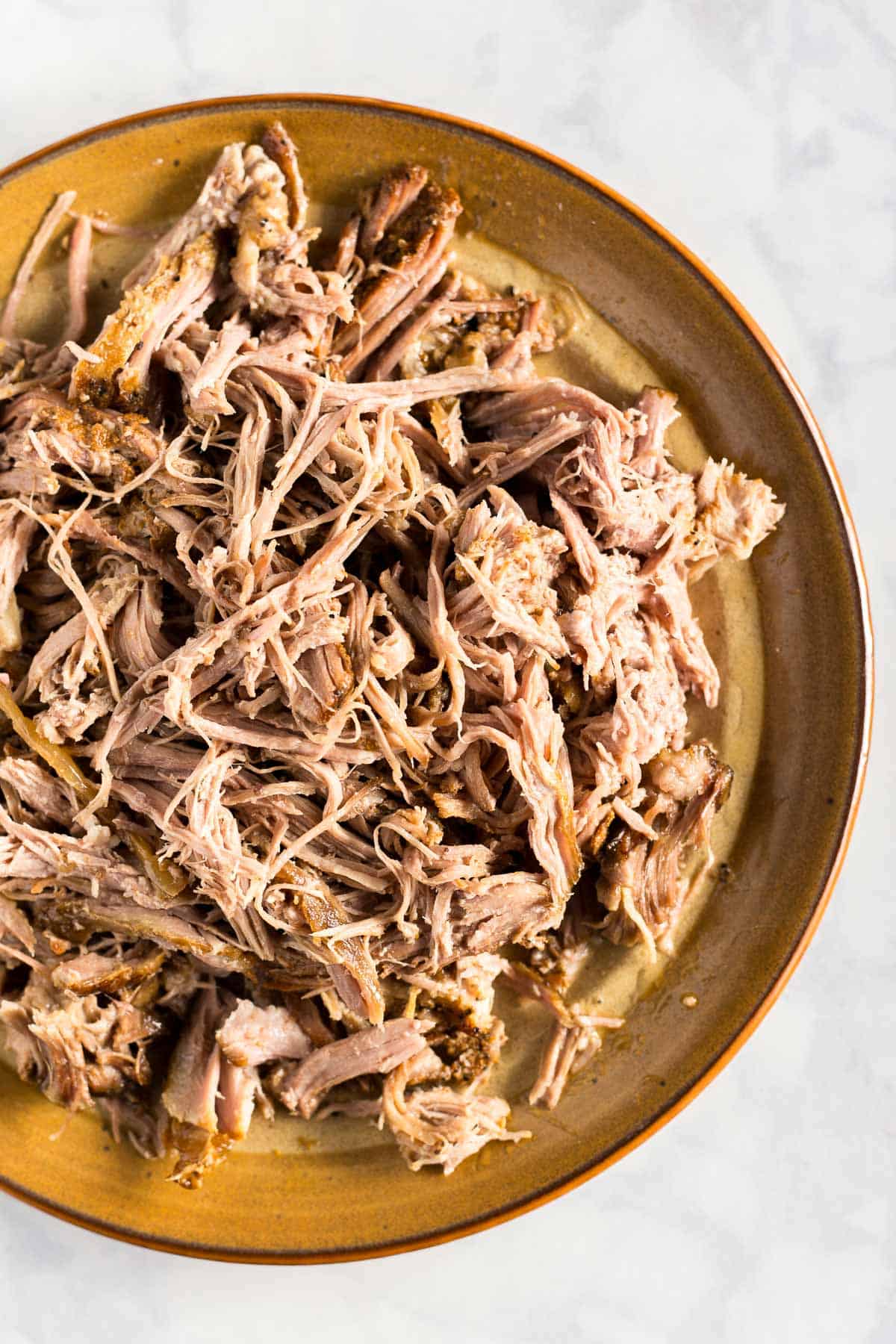 Plate of shredded slow cooker carnitas