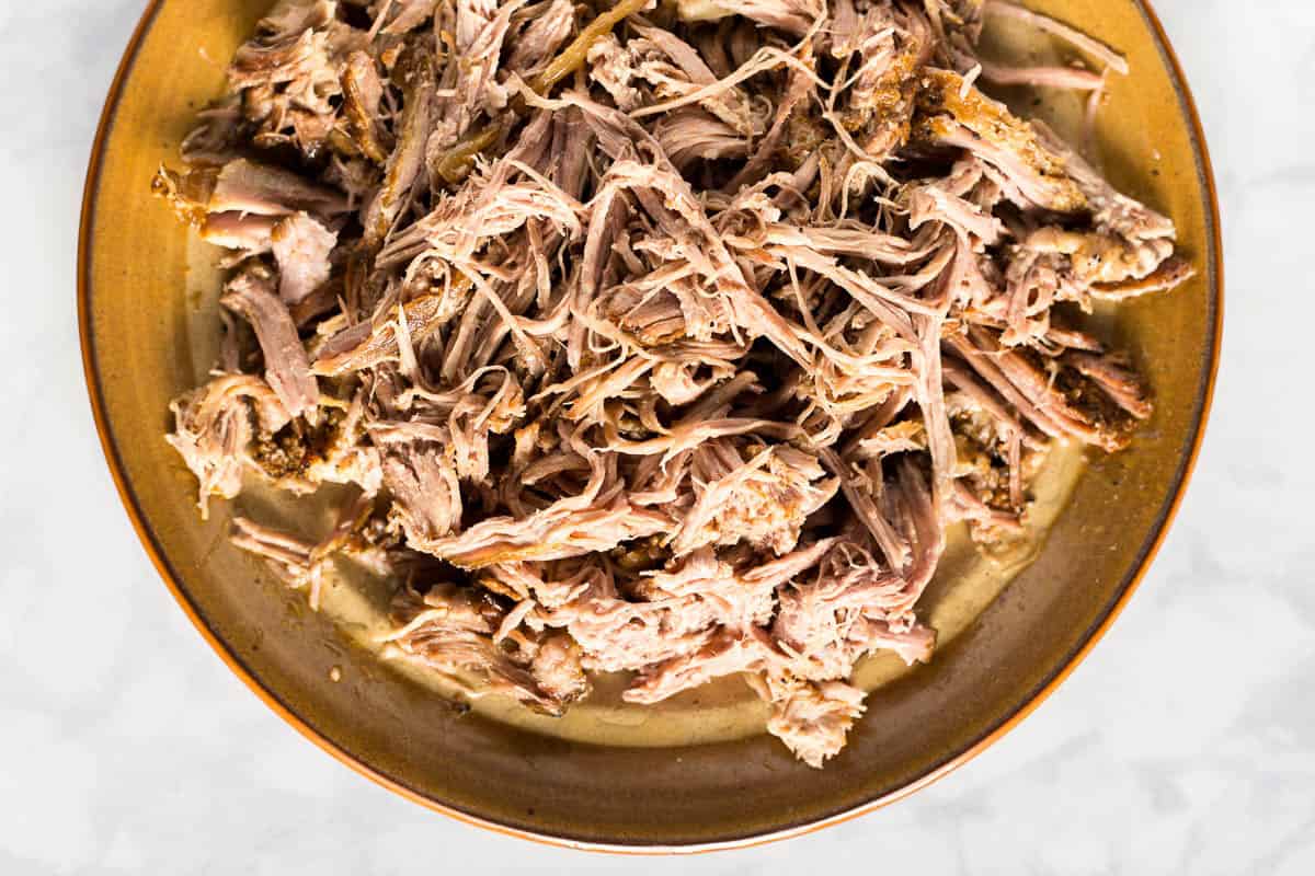Plate of shredded slow cooker carnitas landscape orientation